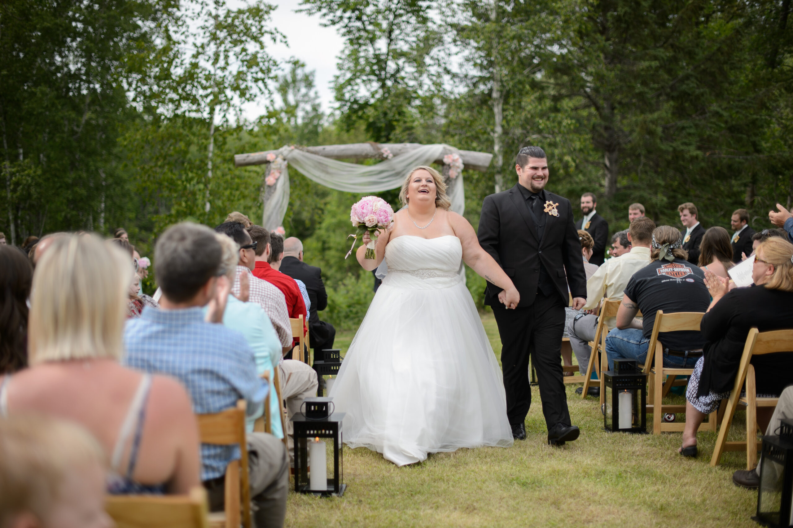 Bride & Groom walk down the aisle after their wedding ceremony